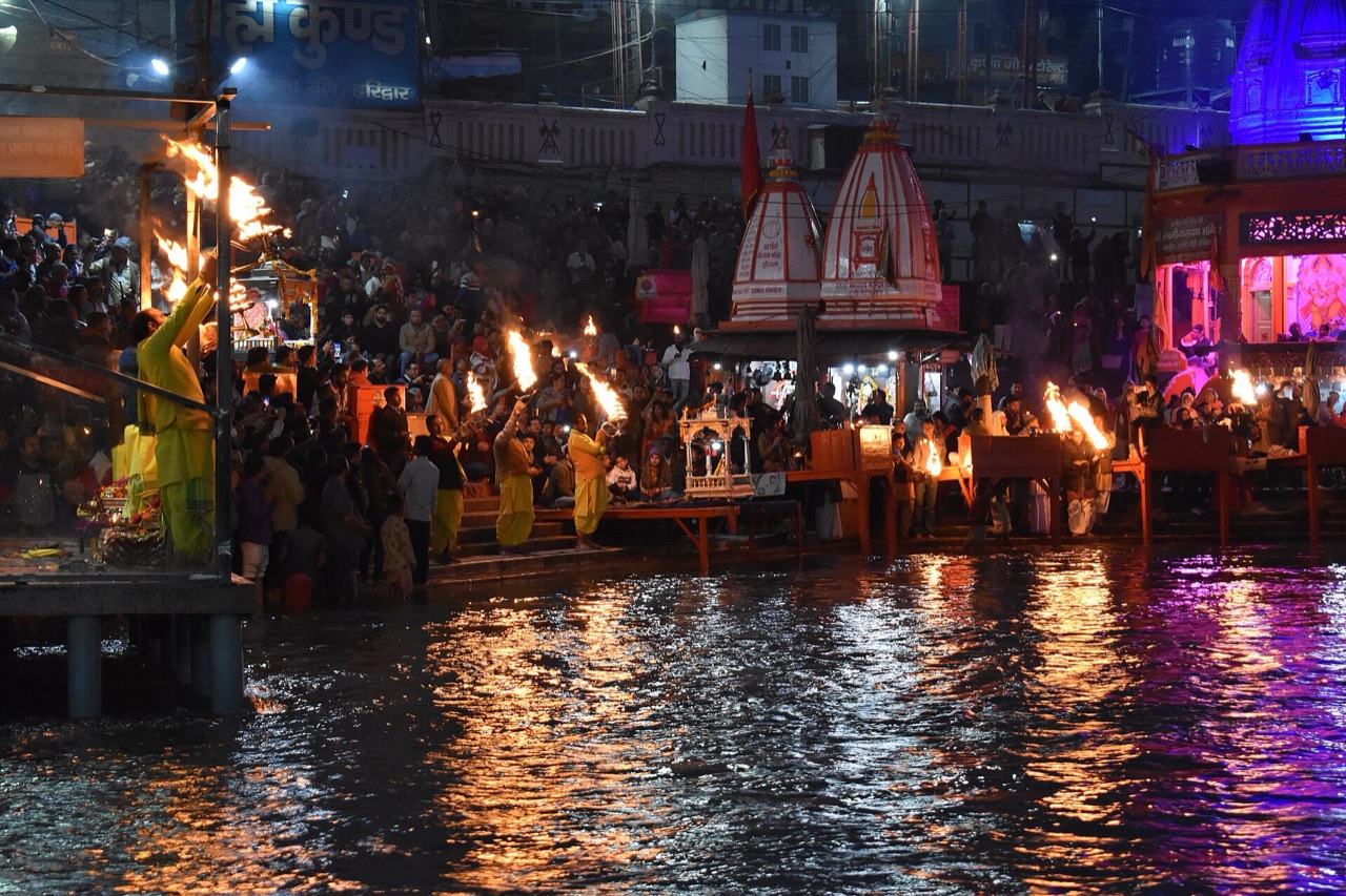 Lamps and temple spires along the ghats of Har Ki Pauri in Haridwar during the evening Ganga Aarti