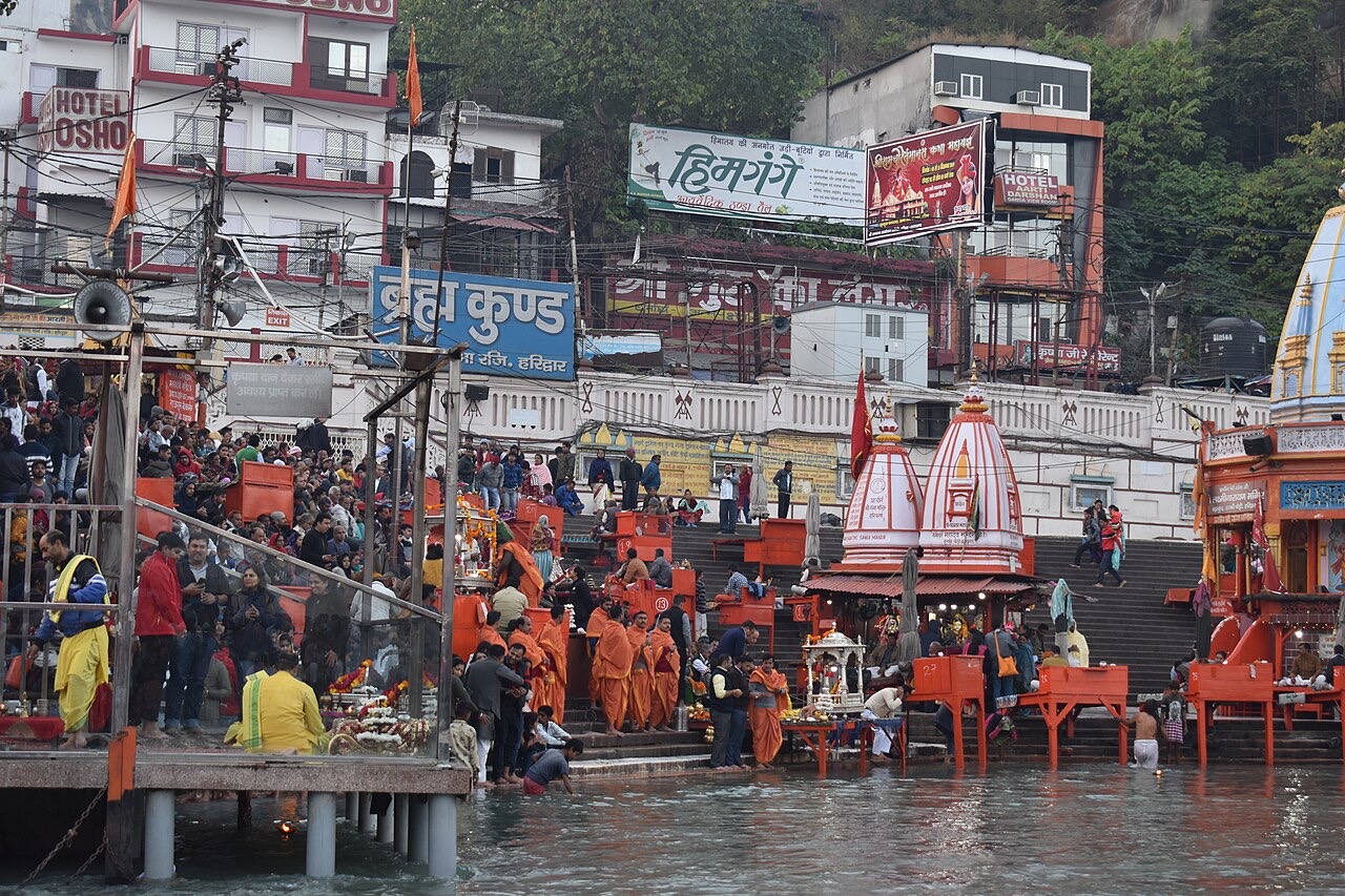 Crowds and saffron canopies at Har Ki Pauri ghat on the Ganga in Haridwar
