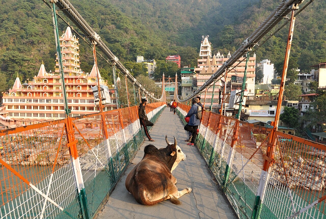 Laxman Jhula suspension bridge in Rishikesh with the tiered temple behind
